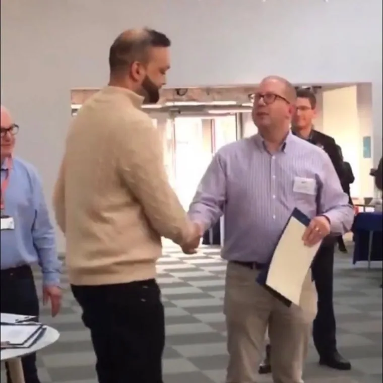Raghav Sharma receiving the Ford Motor Group IoT Innovation Award